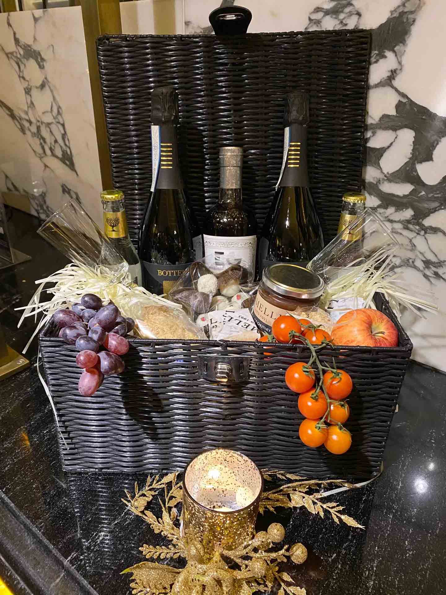Basket with fruits wine and champagne - prosecco wine hamper
